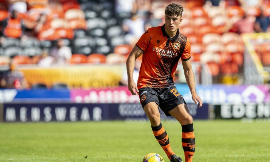 Lewis Neilson in action for United. 