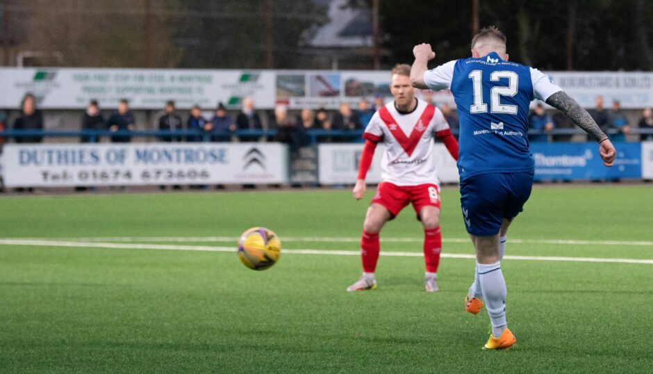 Michael Gardyne plays in a ball.