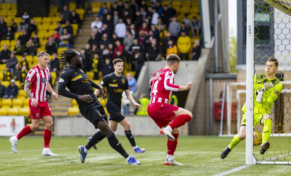 St Johnstone's Glenn Middleton scores.