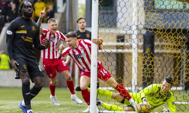 Glenn Middleton celebrates after making it 1-0.