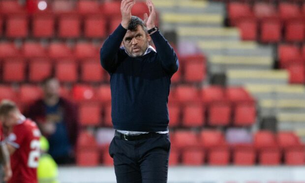 St Johnstone manager Callum Davidson applauds the fans at full time.