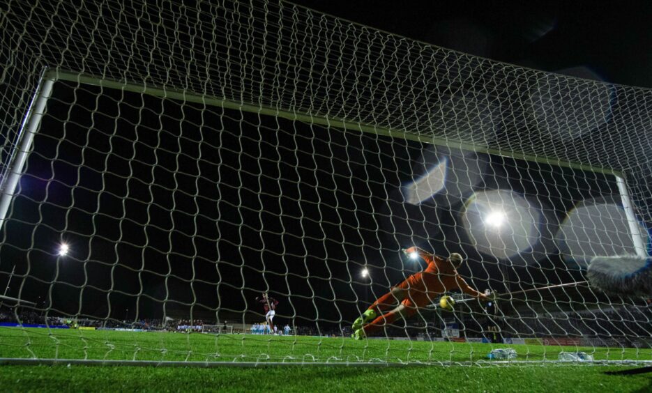 Bobby Linn's penalty is saved by Mark Ridgers.