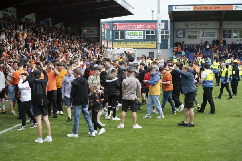 Dundee United fans celebrate as their club secured European football.