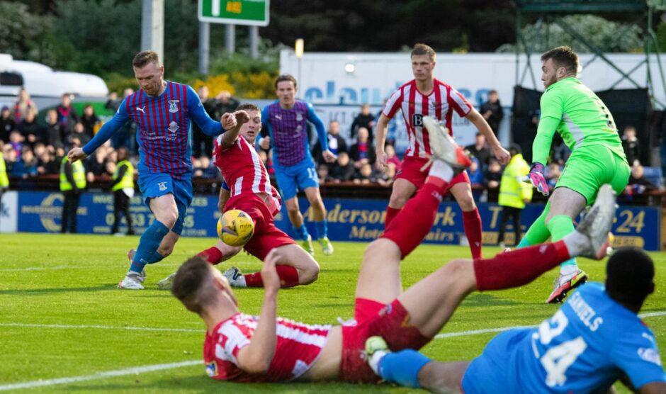 Liam Gordon times a sliding tackle to perfection.