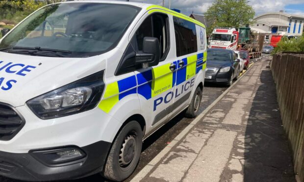 A police van parked on High Street, Rattray, on Tuesday.