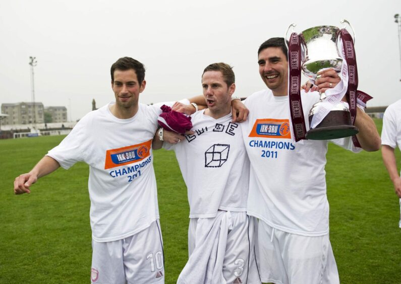 Swankie, left, with teammates and the Third Division trophy in 2011.