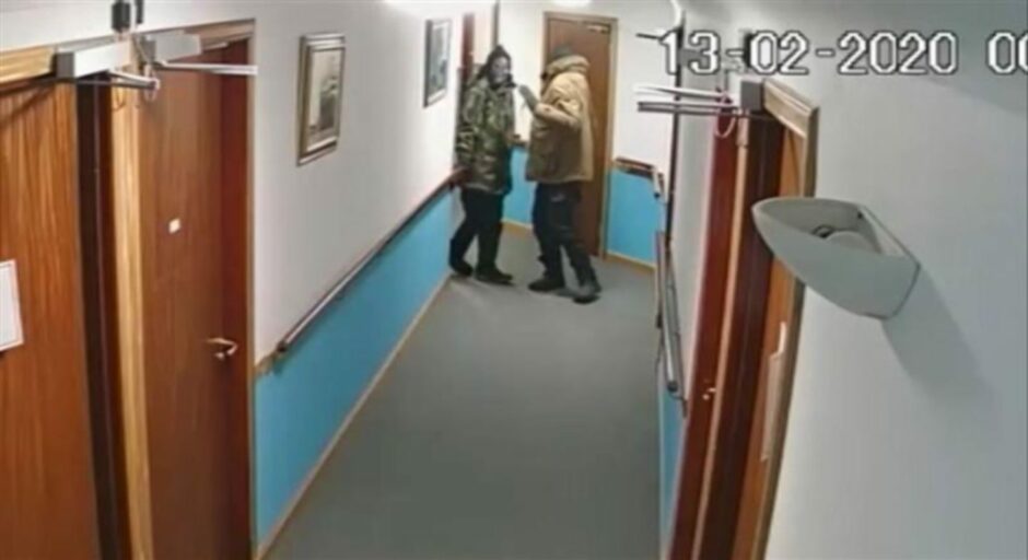 McCrindle (in the brown jacket) and his accomplice appear in the care home corridor.