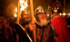 Members of the Jarl Squad as they prepare to set fire to their Viking longship during the Up Helly Aa Viking festival in Lerwick on the Shetland Isles