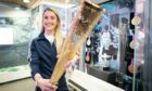 Six-time Olympic medal-winning cyclist Laura Kenny places an Olympic Torch into it's display case at the opening of a new exhibition showcasing the legacy of the London Olympic and Paralympic Games, at Lee Valley VeloPark, Queen Elizabeth Olympic Park. Picture by PA.