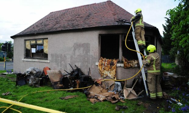 Fire fighters at the derelict community centre in Lauder Road, Kirkcaldy. Pic David Wardle