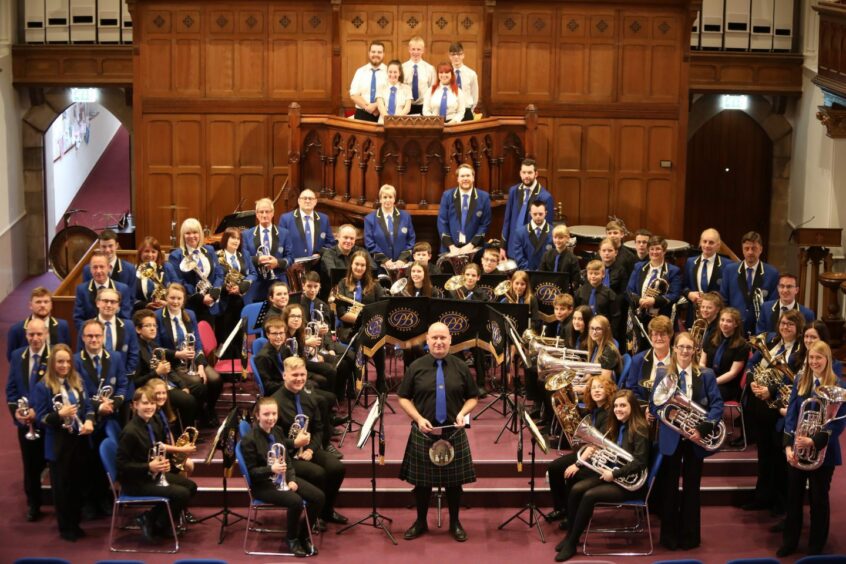 Perthshire Brass in a hall. This wonderful band will be performing at Perth Festival of the Arts 2023.