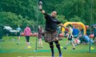 The heavies take to the field and the 16lb ball during the Cupar Highland games at Duffus Park in 2019