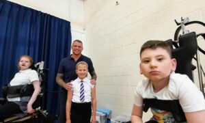 Dave Roper with daughter Lucy (standing) and pupils Emily Birrell and Ethan Buchanan .