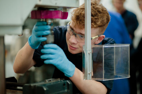 Student working on a machine -engineering jobs in Scotland