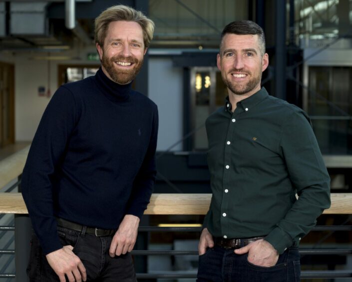 David Smith wearing one of his many polo tops with Henderson Loggie colleague Gavin Black.