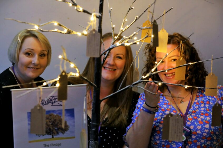 Susie Clark, Jody Docherty and Maxine Linton with a pledge tree which was part of the launch event. Pic: Gareth Jennings/DCT Media.