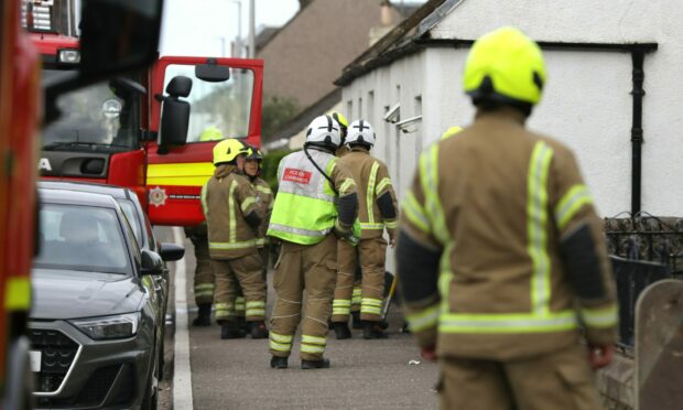 Firefighters at the house