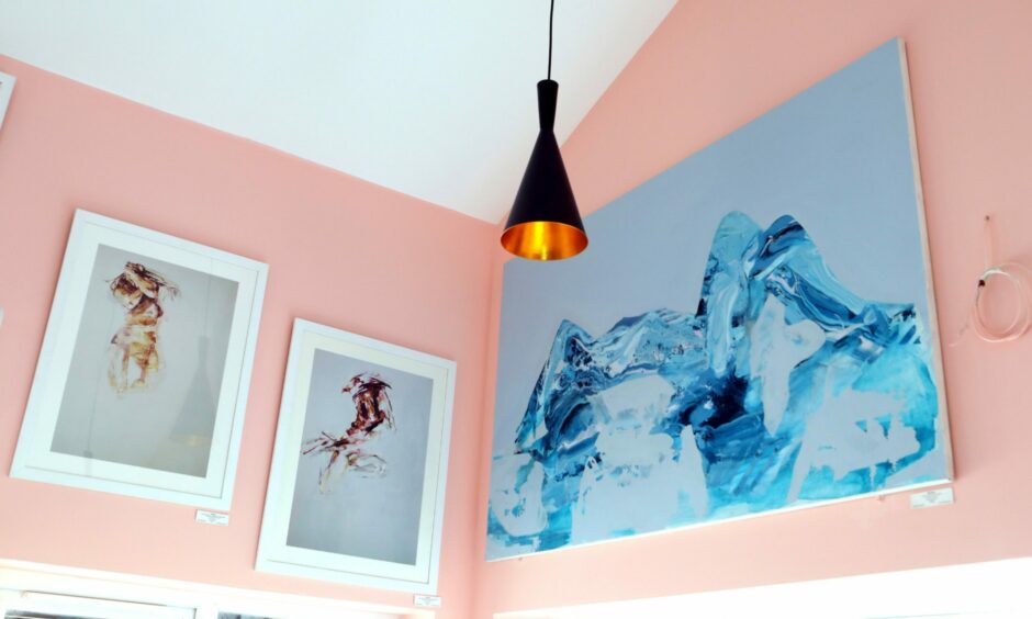 Artwork created by Arbroath born Emma Doig hangs on the walls of Serendipity Cafe.