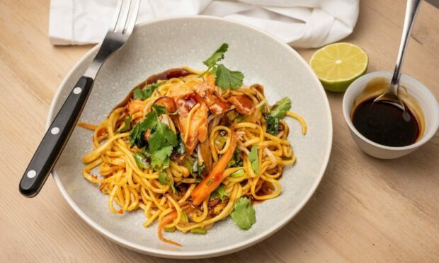 Smoked trout stir-fry with noodles.