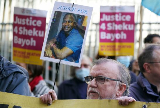Supporters at a recent vigil for Sheku Bayoh. The inquiry has heard further police evidence. Image: Andrew Milligan/PA Wire.