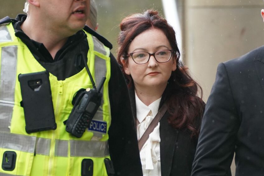 Former PC Nicole Short (centre) arrives at Capital House in Edinburgh for the public inquiry into Sheku Bayoh's death.