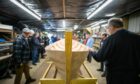 The hull of the skiff is turned for the interior to be fitted. Pic: Kim Cessford/DCT Media.
