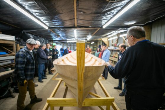 The hull of the skiff is turned for the interior to be fitted. Pic: Kim Cessford/DCT Media.