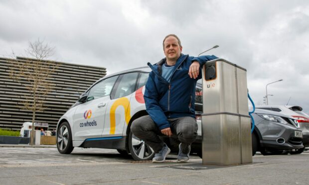 EV consultant Gary McRae with one of the 'pop up' EV chargers outside the V&A in Dundee.
