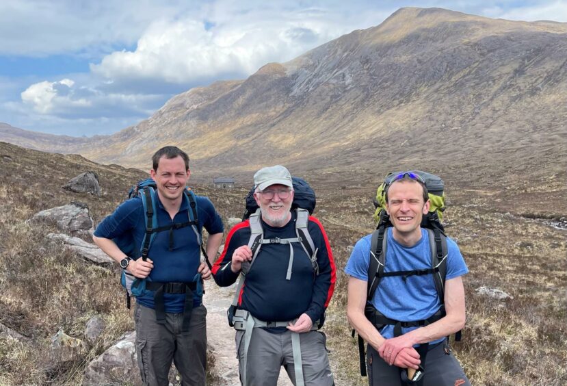 Martin (centre) was in the mountains with friends Michael Self (left) and Tim Mineard.
