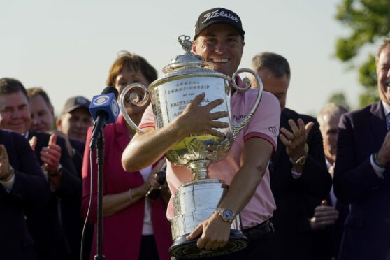 Justin Thomas gets a grip on the Wanamaker after his win at Southern Hills.
