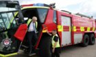 Prime Minister Boris Johnson gets off a vehicle of the Southampton airport fire and rescue crew during a visit to the Eastleigh constituency, while on the local elections campaign trail. Picture via PA.
