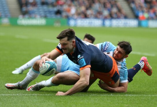 Blair Kinghorn scores Edinburgh's first try against Glasgow.