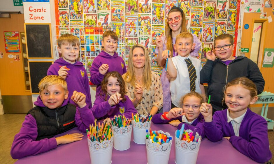  Pictured with some of the P4 class are Dundee RAiSE primary science development officer Sarah Hynie Klemen (centre) and teacher Jayne Mays.