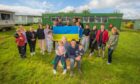 The Marshall family (front) have welcomed 36 Ukrainian refugees to their farm in Alyth.