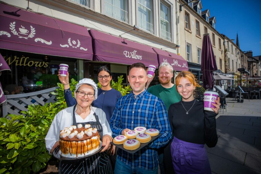 Staff outside Willows in Broughty Ferry holding cakes and bakes