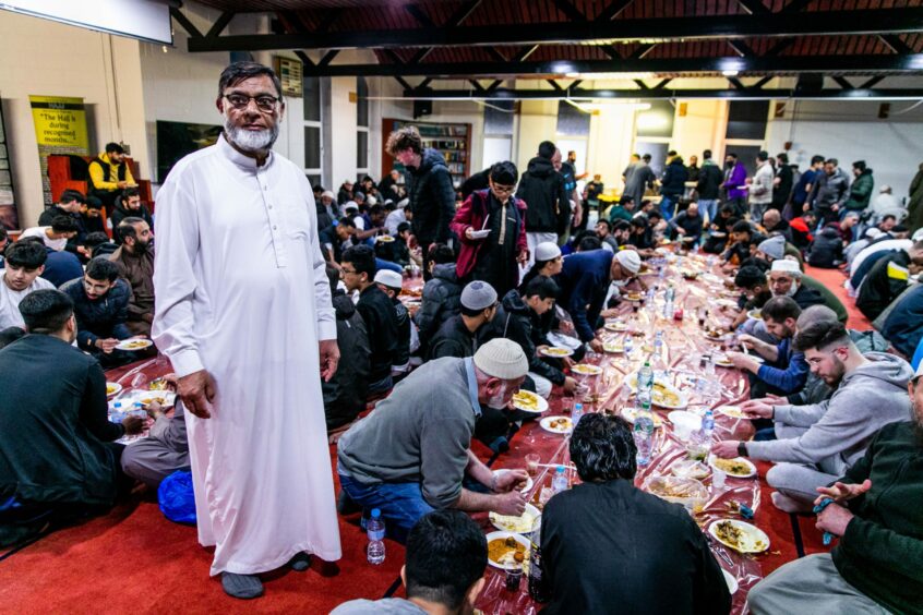 Bashir Chohan with people celebrating the end of their fast at Dundee Central Mosque.