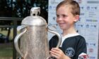 Young Strathie Shark Liam Reid got his hands on the Calcutta Cup when it visited Forfar in 2018