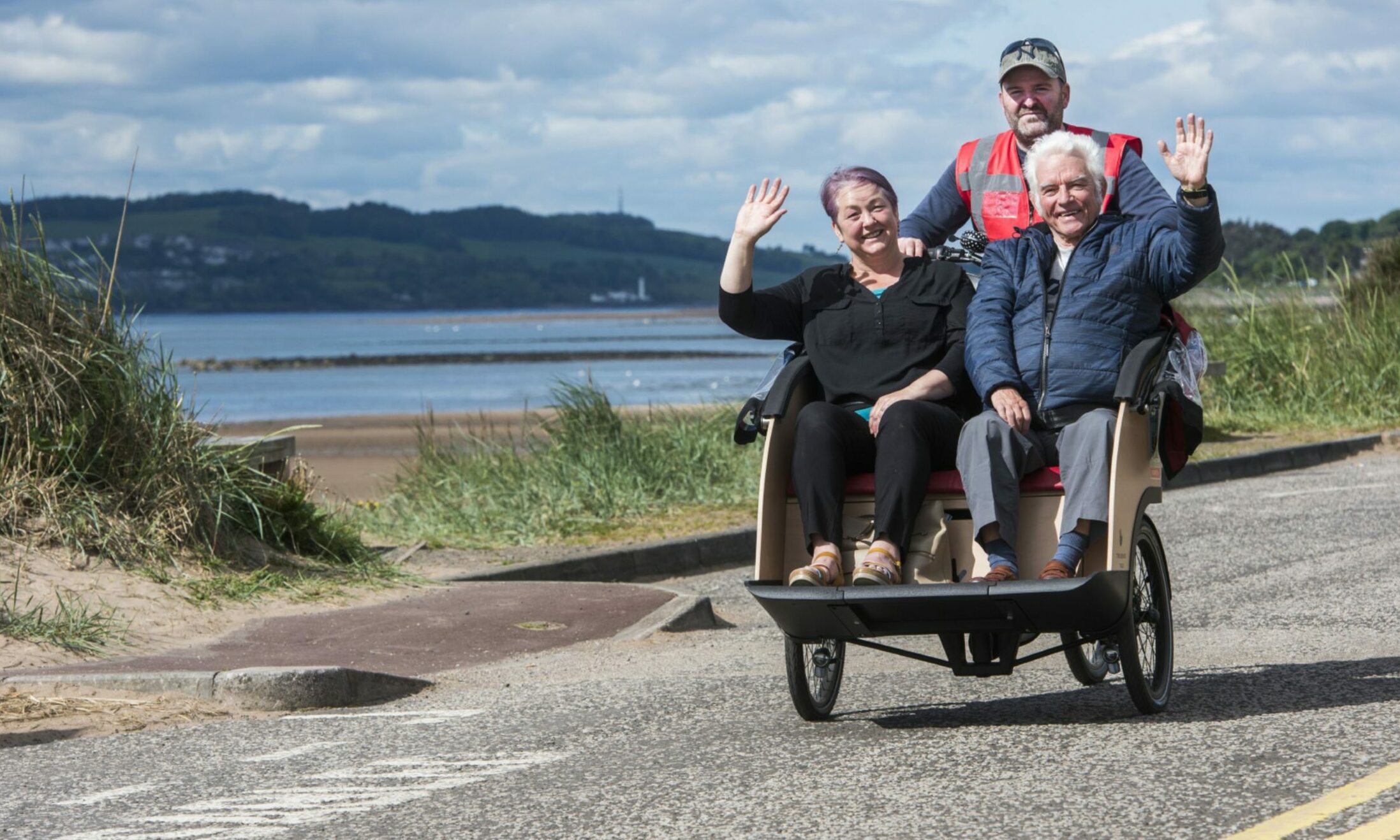 Volunteer pilot Richard Rooney takes Councillor Beth Whiteside and visitor Adam Harper for a spin on the Monifieth group's official launch day. Photo: Alan Richardson / Pix-AR.co.uk