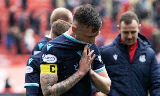 Dundee defender Jordan McGhee disappointed at full-time at Aberdeen.