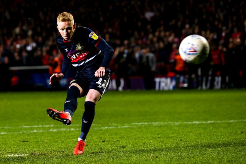 Ali Crawford converts his penalty for Doncaster.