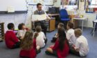 The amount of money being spent on helping additional needs pupils in Dundee has fallen by more than half in less than 10 years.