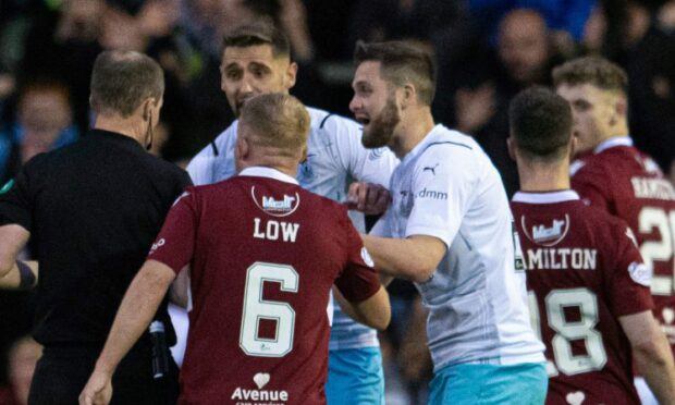 Danny Devine protests against his sending off.