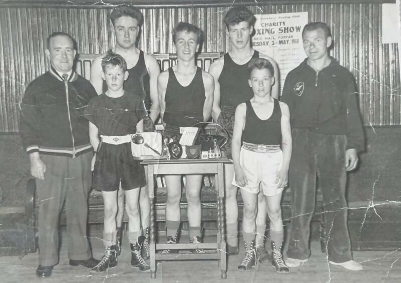 Jimmy shown second from right with his team mates and coaches from Lochee Boys Club.