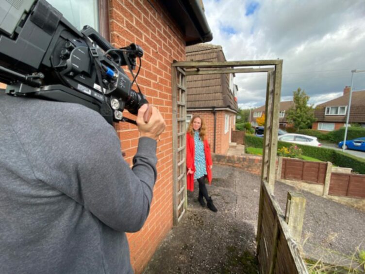 Marrel Maxwell being filmed for the TV show Homes Under the Hammer, which she presents