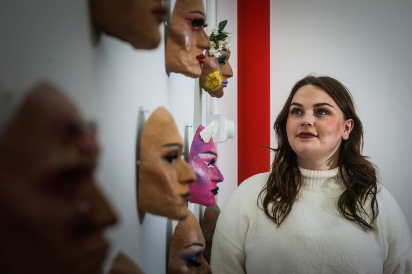 University of Dundee's Hannah Adams admires some of the degree show works.