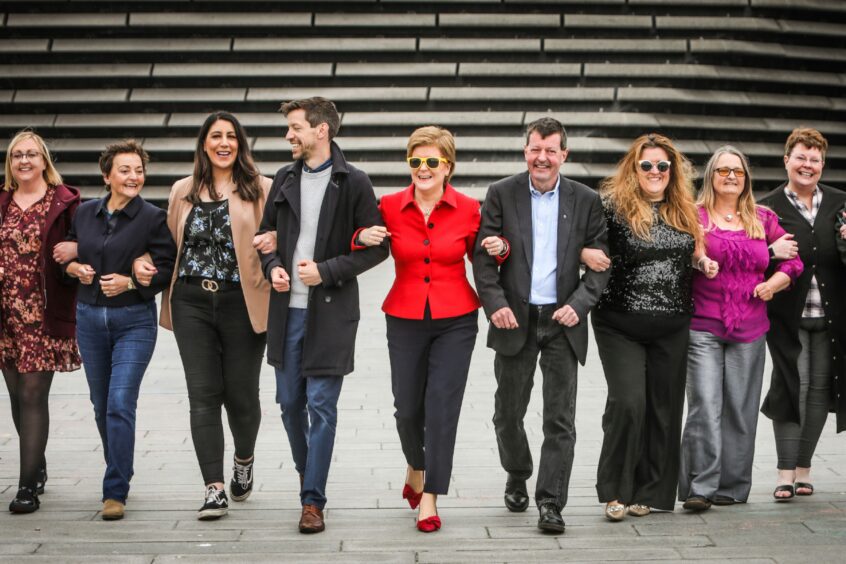 Nicola Sturgeon with re-instated council leader John Alexander and other councillors