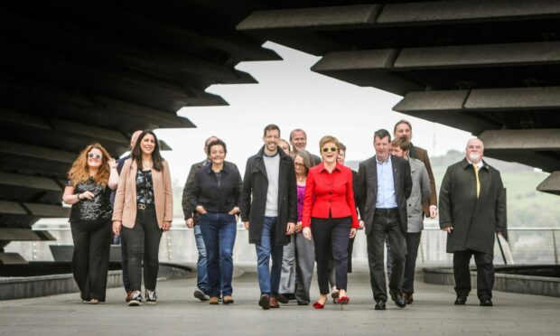 Nicola Sturgeon celebrates with some of the newly elected SNP councillors in Dundee at the V&A