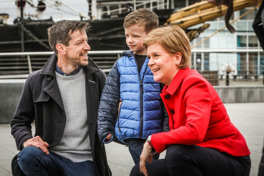 Nicola Sturgeon with John Alexander and his son Jack at the V&amp;A.