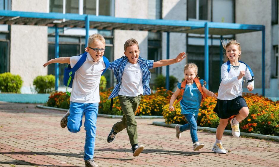 Children running out of school at end of term.