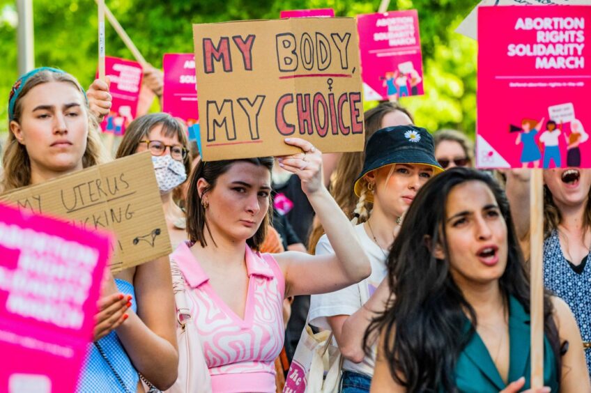 Pro-abortion protesters march to the US embassy in London to protest.